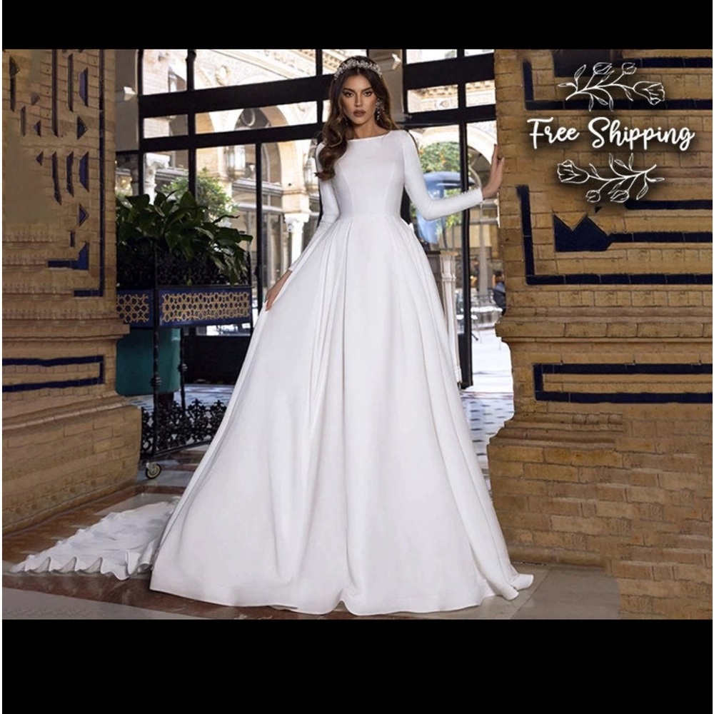 White wedding dress.  Size 14.  Never worn.  Ordered then plans changed.